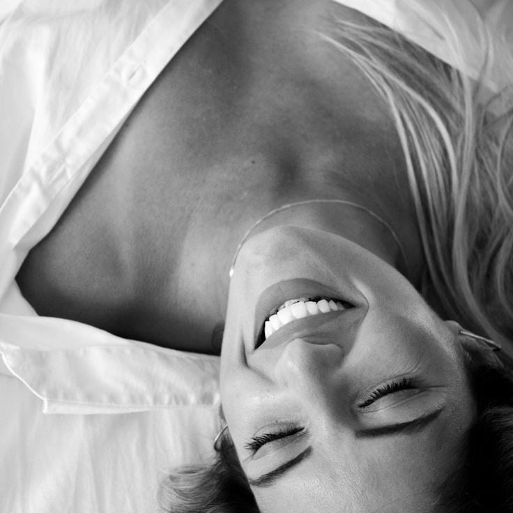 Aarav Sinha, Lead Design Curator at Meadow Glade Quill, reviewing corporate floral arrangements